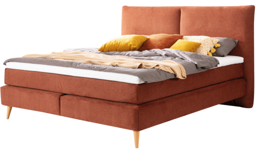 Boxspringbett Neroni mit rostbraunem Stoff und dekoriert